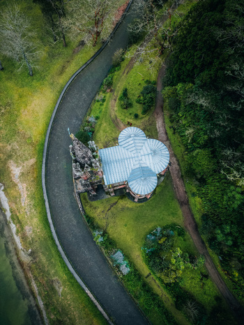 Aerial view of Ermida de Nossa Senhora das Vit&oacute;rias nestled between verdant landscapes and a winding pathway creating a serene oasis Furnas A&ccedil;ores Portugal.