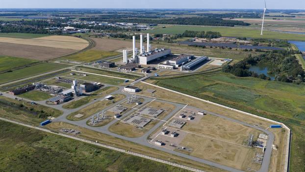 Aerial view of the Gasunie and Air Products nitrogen factory surrounded by industrial infrastructure and green fields in the rural landscape of Muntendam Groningen Netherlands.