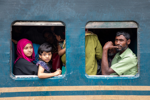 Dhaka Bangladesh 15 June 2018 View of people looking out of the windows of a train at Airport Railway Station. Dhaka Bangladesh 15 June 2018 View of people looking out of the windows of a train at Airport Railway Station.