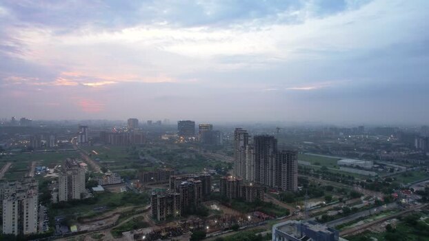 Aerial view of Gurugram skyscrapers at dusk India.