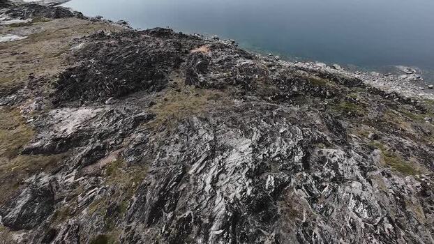 FPV aerial view of rocky terrain in Uummannaq Greenland. FPV aerial view of rocky terrain in Uummannaq Greenland.