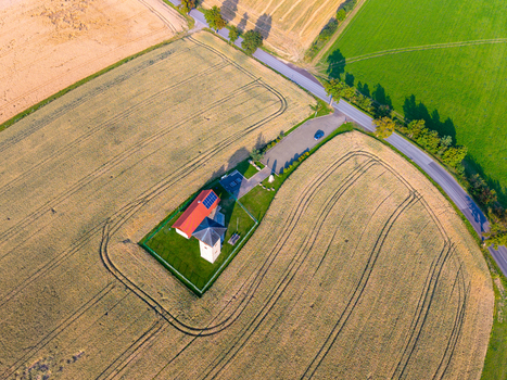 Aerial view of Rozhledna U Borovice surrounded by golden wheat fields and green meadows in Semily Liberecky kraj Czechia. Aerial view of Rozhledna U Borovice surrounded by golden wheat fields and green meadows in Semily Liberecky kraj Czechia.