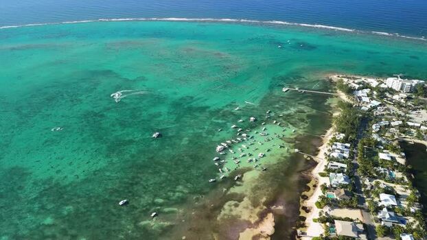 Aerial view of boats anchored off Grand Cayman Cayman Islands. Aerial view of boats anchored off Grand Cayman Cayman Islands.