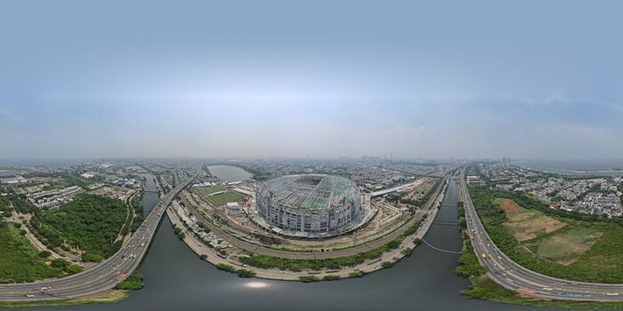 Aerial view of Jakarta International Stadium under construction surrounded by highways and urban landscape in Tanjung Priok Jakarta Indonesia. Aerial view of Jakarta International Stadium under construction surrounded by highways and urban landscape in Tanjung Priok Jakarta Indonesia.