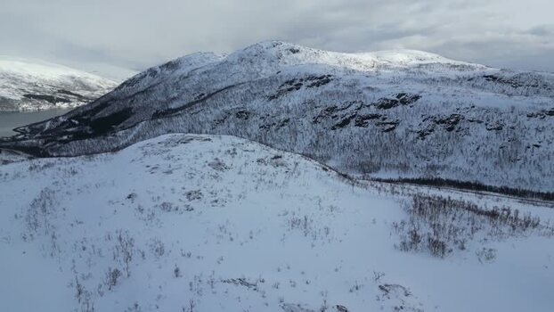 Aerial view of snow covered mountains on Kvaloya Norway.