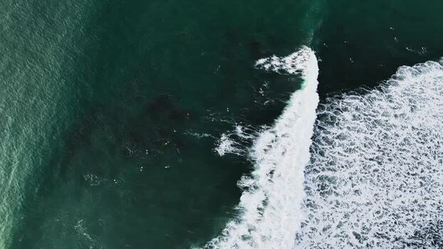 Aerial view of ocean waves crashing in Raglan New Zealand. Aerial view of ocean waves crashing in Raglan New Zealand.