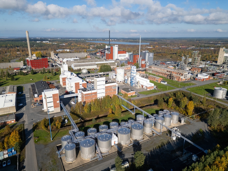 Oulu Finland 25 September 2026 Aerial view of Takalaanila industrial area with large storage tanks factory buildings and surrounding forest under a clear blue sky. Oulu Finland 25 September 2026 Aerial view of Takalaanila industrial area with large storage tanks factory buildings and surrounding forest under a clear blue sky.