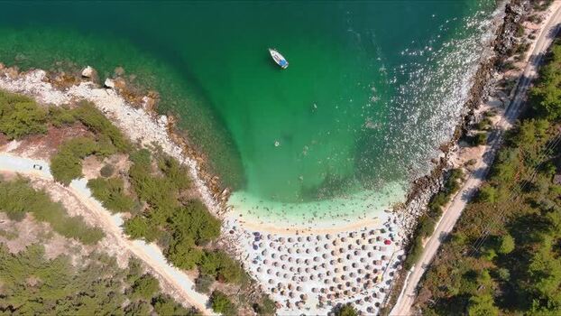 Aerial view of a beach with umbrellas in Thasos Greece. Aerial view of a beach with umbrellas in Thasos Greece.
