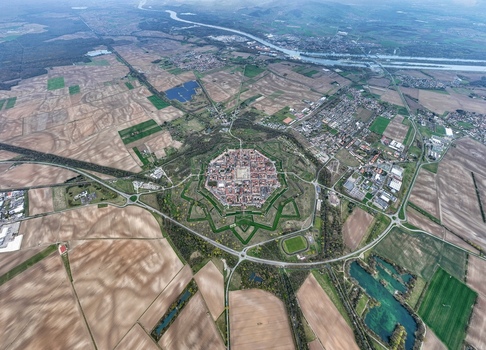 Aerial view of the star shaped fortress of Neuf Brisach a UNESCO World Heritage site surrounded by a network of roads and agricultural fields Neuf Brisach Grand Est France.