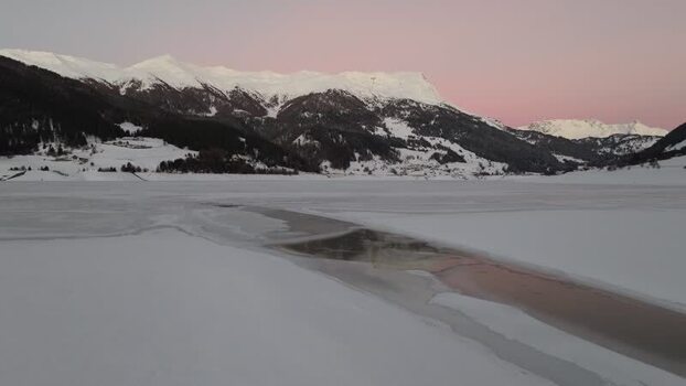 Aerial view of frozen Reschensee lake in Italy. Aerial view of frozen Reschensee lake in Italy.
