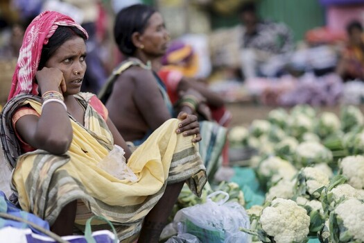 Odisha India 26 March 2026 View of women amidst a burst of white cauliflower heads their vibrant fabrics a stark contrast against the earthy tones of the bustling market. Odisha India 26 March 2026 View of women amidst a burst of white cauliflower heads their vibrant fabrics a stark contrast against the earthy tones of the bustling market.