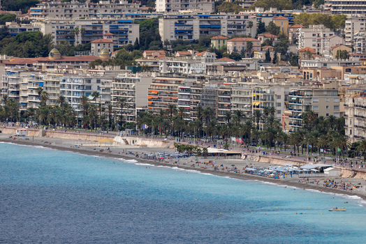 Aerial view of the Promenade des Anglais beach with turquoise sea palm trees and urban architecture in Nice Provence Alpes Cote d Azur France. Aerial view of the Promenade des Anglais beach with turquoise sea palm trees and urban architecture in Nice Provence Alpes Cote d Azur France.