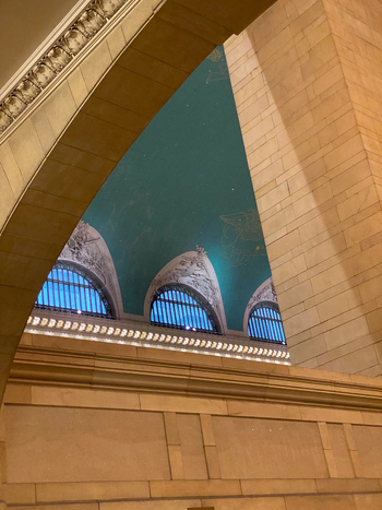 View of the celestial ceiling and arched windows inside Grand Central Terminal with its teal color and gold constellations New York New York United States. View of the celestial ceiling and arched windows inside Grand Central Terminal with its teal color and gold constellations New York New York United States.