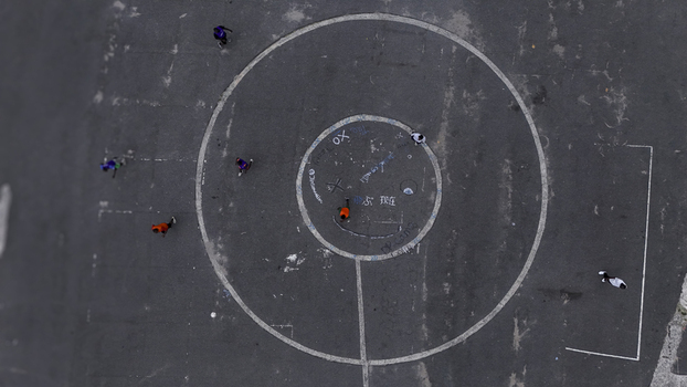 Aerial view of National Stadium Surulere Lagos with people playing on the asphalt court featuring circular markings Lagos Lagos Nigeria. Aerial view of National Stadium Surulere Lagos with people playing on the asphalt court featuring circular markings Lagos Lagos Nigeria.