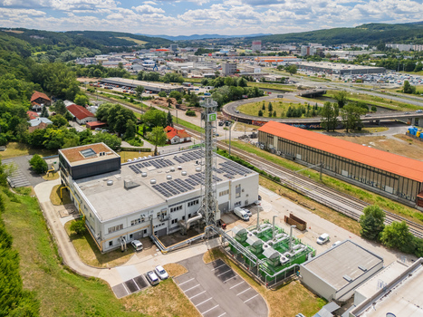 Aerial view of the STEFE Banska Bystrica heating plant with industrial buildings a tall chimney solar panels and infrastructure in Banska Bystrica Banskobystricky kraj Slovakia. Aerial view of the STEFE Banska Bystrica heating plant with industrial buildings a tall chimney solar panels and infrastructure in Banska Bystrica Banskobystricky kraj Slovakia.