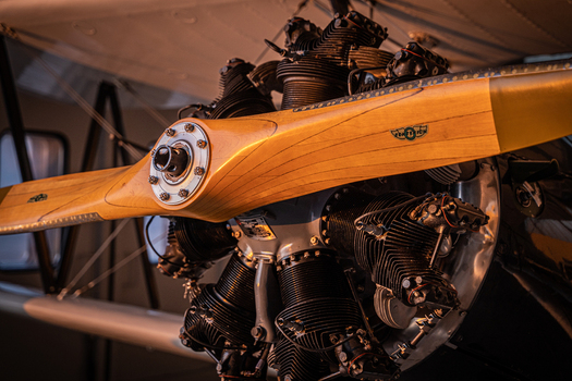 View of a vintage radial aircraft engine with a wooden propeller at Hannover Airport in Langenhagen Niedersachsen Germany. View of a vintage radial aircraft engine with a wooden propeller at Hannover Airport in Langenhagen Niedersachsen Germany.