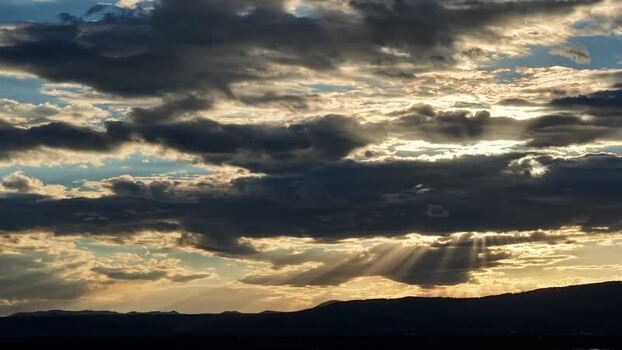 Aerial view of golden sun rays over Los Alamos United States.