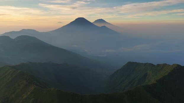 Aerial view of Dieng Plateau mountains at sunrise Indonesia.