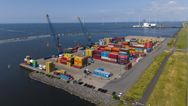 Aerial view of TMA Terminals Lelystad featuring colorful shipping containers industrial cranes and port infrastructure along the IJsselmeer coastline in Lelystad Flevoland Netherlands. Aerial view of TMA Terminals Lelystad featuring colorful shipping containers industrial cranes and port infrastructure along the IJsselmeer coastline in Lelystad Flevoland Netherlands.