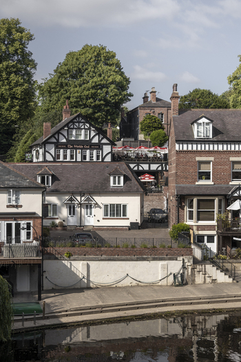 Knaresborough England United Kingdom 14 July 2026 View of the historic riverside buildings and The World s End pub with traditional brick architecture.