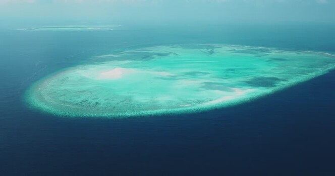Aerial view of a coral reef atoll in the Indian Ocean Maldives. Aerial view of a coral reef atoll in the Indian Ocean Maldives.