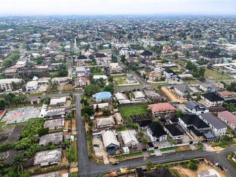 Aerial view of houses and streets creating a rhythmic pattern under the vast sky the city unfolds with a quiet charm Uyo Akwa Ibom Nigeria. Aerial view of houses and streets creating a rhythmic pattern under the vast sky the city unfolds with a quiet charm Uyo Akwa Ibom Nigeria.