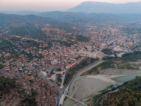 Aerial view of the historic city of Berat with its traditional Ottoman houses Osum River and surrounding mountains in Berat Berat County Albania. Aerial view of the historic city of Berat with its traditional Ottoman houses Osum River and surrounding mountains in Berat Berat County Albania.