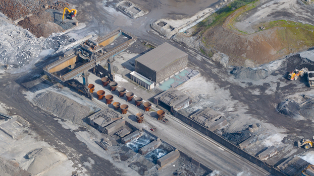 Aerial view of Tata Steel industrial plant with heavy machinery gantry crane and metal ladles on the ground in Velsen Noord Noord Holland Netherlands. Aerial view of Tata Steel industrial plant with heavy machinery gantry crane and metal ladles on the ground in Velsen Noord Noord Holland Netherlands.
