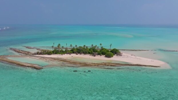 Aerial view of island and reef Maldives.
