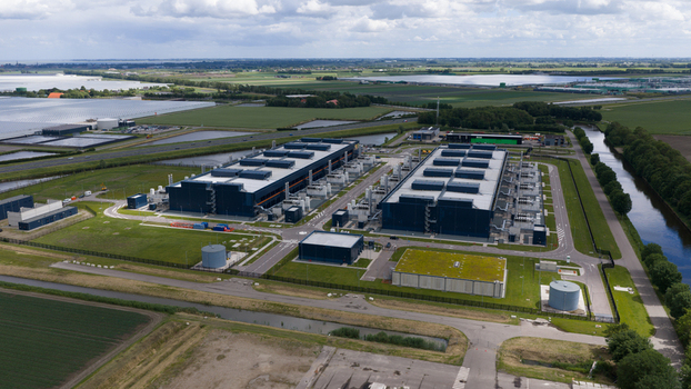 Aerial view of the Agriport data center complex green fields and canals under a cloudy sky Middenmeer Noord Holland Netherlands. Aerial view of the Agriport data center complex green fields and canals under a cloudy sky Middenmeer Noord Holland Netherlands.