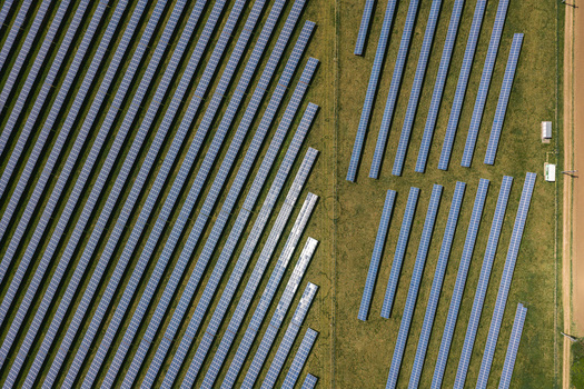 Aerial view of rows of solar panels in a large photovoltaic power plant on green fields Sivice South Moravian Region Czechia.