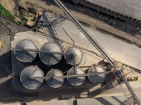 Aerial view of industrial grain silos and conveyor systems at a facility in Bajos de Haina San Cristobal Provinc Dominican Republic.