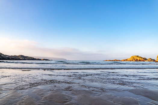 View of the sandy beach and rocky coastline at Cloughglass County Donegal Ireland. View of the sandy beach and rocky coastline at Cloughglass County Donegal Ireland.