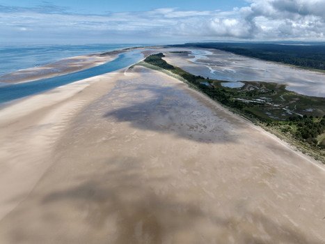 Aerial view of the Moray Firth Coast near Nairn featuring expansive sandy beaches tidal flats and the meeting of the sea with the coastline in Nairn Scotland United Kingdom.