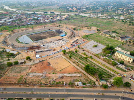 Kaduna Nigeria 13 May 2026 Aerial view of Ahmadu Bello Stadium under renovation with construction equipment surrounding urban landscape and the Kaduna River in the distance. Kaduna Nigeria 13 May 2026 Aerial view of Ahmadu Bello Stadium under renovation with construction equipment surrounding urban landscape and the Kaduna River in the distance.