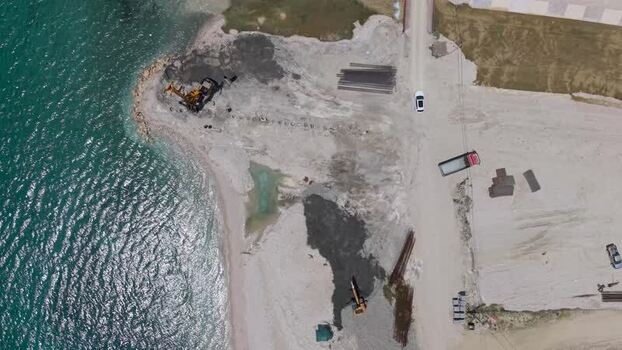 Aerial view of coastal construction site in Himare Albania.
