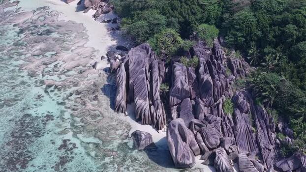 Aerial view of Anse Reunion granite boulders Seychelles.