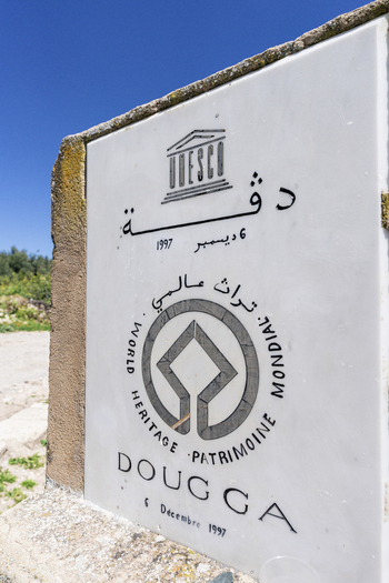 View of the UNESCO World Heritage plaque at the Dougga Archaeological Site in Teboursouk Beja Governorate Tunisia.