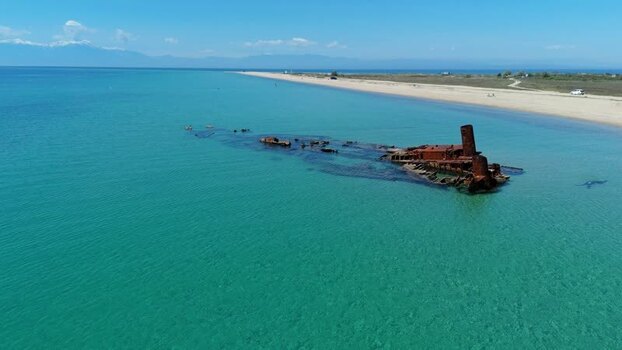 Aerial view of Shipwreck Epanomi in turquoise waters Greece.