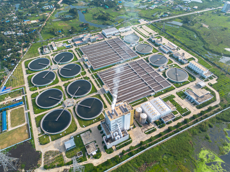 Aerial view of the Sewage Treatment Plant Dhaka WASA with circular sedimentation tanks and industrial facilities Dhaka Dhaka Division Bangladesh. Aerial view of the Sewage Treatment Plant Dhaka WASA with circular sedimentation tanks and industrial facilities Dhaka Dhaka Division Bangladesh.