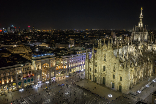 Milan Italy 23 September 2026 Aerial view of the illuminated Duomo di Milano and Galleria Vittorio Emanuele II at night with the city skyline in the background. Milan Italy 23 September 2026 Aerial view of the illuminated Duomo di Milano and Galleria Vittorio Emanuele II at night with the city skyline in the background.