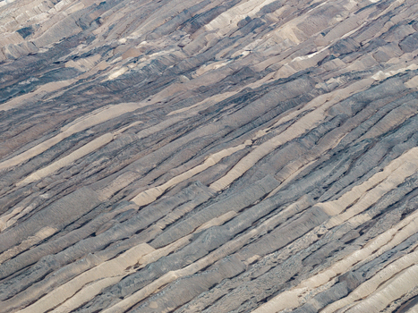 Aerial view of Tagebau Welzow Sud brown coal open pit mine showing distinct layers of earth and coal strata in Spremberg Brandenburg Germany. Aerial view of Tagebau Welzow Sud brown coal open pit mine showing distinct layers of earth and coal strata in Spremberg Brandenburg Germany.