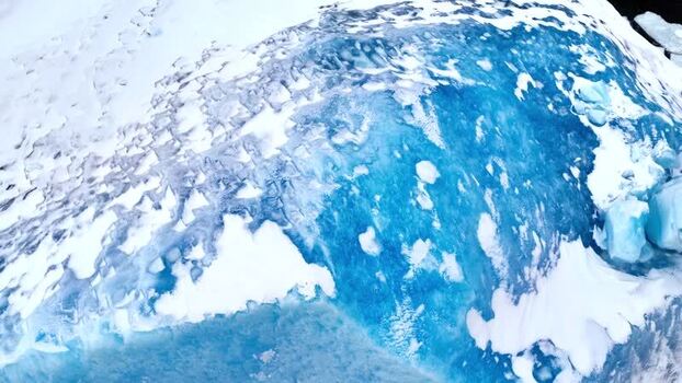 Aerial view of deep blue glacial ice and snow Greenland. Aerial view of deep blue glacial ice and snow Greenland.
