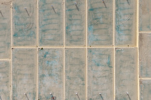 Aerial view of a residential development site with cleared land plots boundary lines and tire tracks in Perth Western Australia Australia. Aerial view of a residential development site with cleared land plots boundary lines and tire tracks in Perth Western Australia Australia.