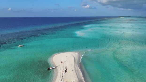 Aerial view of a tropical sandbank and turquoise ocean Maldives. Aerial view of a tropical sandbank and turquoise ocean Maldives.