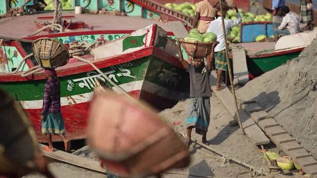 View of workers unloading watermelons at Sadarghat Bangladesh.