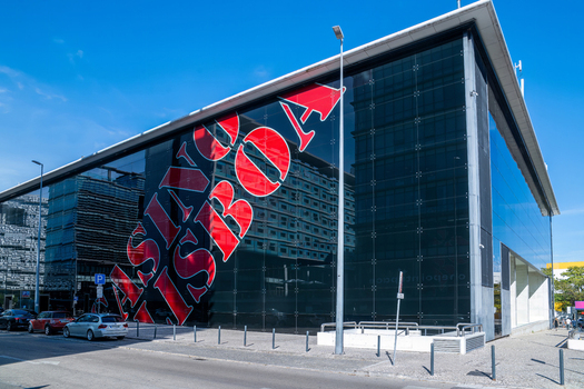Lisboa Portugal 17 September 2026 View of Casino Lisboa a modern glass fronted building with prominent red lettering reflecting the clear blue sky on a sunny day. Lisboa Portugal 17 September 2026 View of Casino Lisboa a modern glass fronted building with prominent red lettering reflecting the clear blue sky on a sunny day.