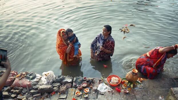 View of women performing a religious ritual in the river Bangladesh. View of women performing a religious ritual in the river Bangladesh.