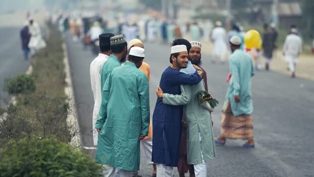 View of men hugging during Eid celebrations in Bogura Bangladesh. View of men hugging during Eid celebrations in Bogura Bangladesh.