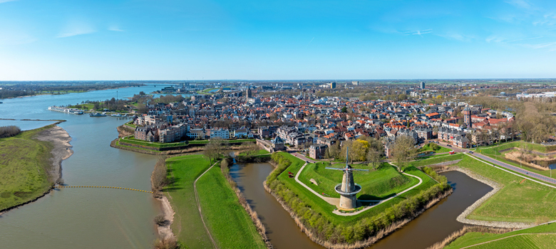 Aerial view of the historic city center and the De Hoop windmill on star shaped fortifications along the river in Gorinchem South Holland Netherlands.